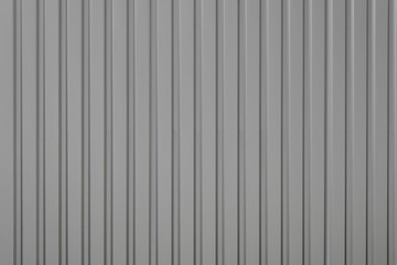 Gray relief striped stone wall, fence or roof texture