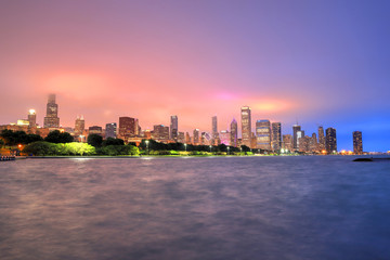 Obraz premium Chicago, Illinois, USA - June 22, 2018 - The Chicago skyline at night after a storm across Lake Michigan.