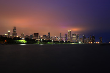 Fototapeta premium Chicago, Illinois, USA - June 22, 2018 - The Chicago skyline at night after a storm across Lake Michigan.