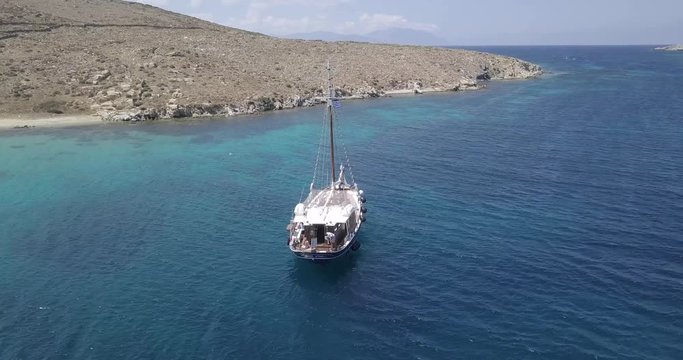 Aerial view of yacht sailing from Mykonos, Greece. 