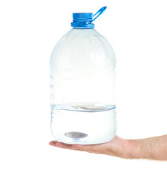 Water bottle in a hand on a white background isolation