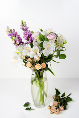 bouquet of fresh flowers of snapdragon, roses, alstroemeria in a