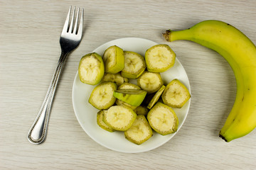 Cut banana. Fresh summer food concept. Vegetarian healthy diet