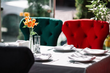 Table served for dinner with flowers on it