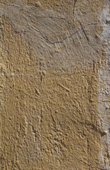 Old stones wall covered with paint