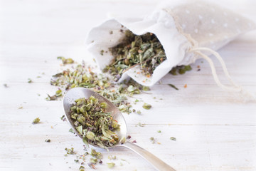Dried thyme on white wooden table