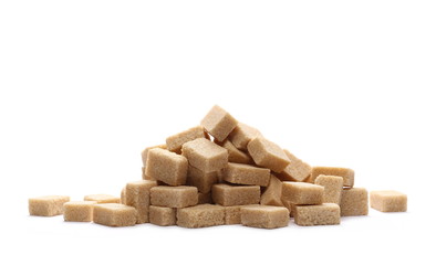 Brown cane sugar cubes isolated on white background