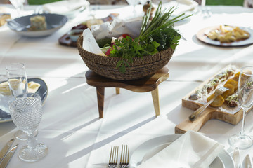 Serving of a festive table, plate, napkin, knife, fork.