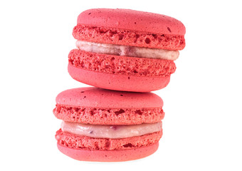 Two red macaroon isolated on white background, closeup.