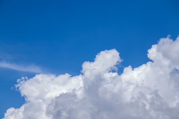 background of blue sky with fluffy white clouds	