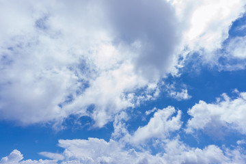 background of blue sky with fluffy white clouds	