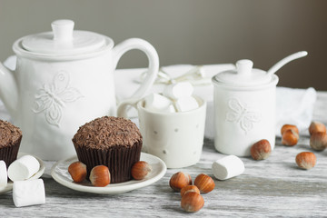 Teapot, cupcakes and different decorations