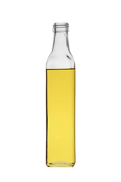 olive vegetable oil in glass bottle without a lid, isolated on white background