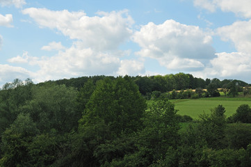 Fototapeta na wymiar rural landscape with wooded hills