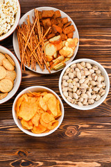 Snacks on a wooden background. Space for text or design.