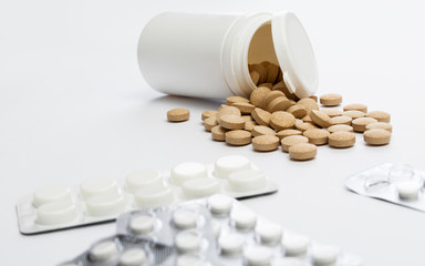 flipped vitamins bottle on white