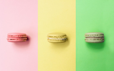 Colorful macarons with same color background