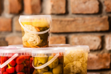Jars with pickled vegetables in cellar