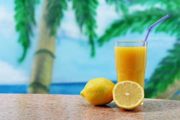 fresh orange juice with lemon and orange in a glass