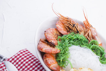 Rice noodles and shrimp are large, oriental cuisine, healthy lunch. Copy space.
