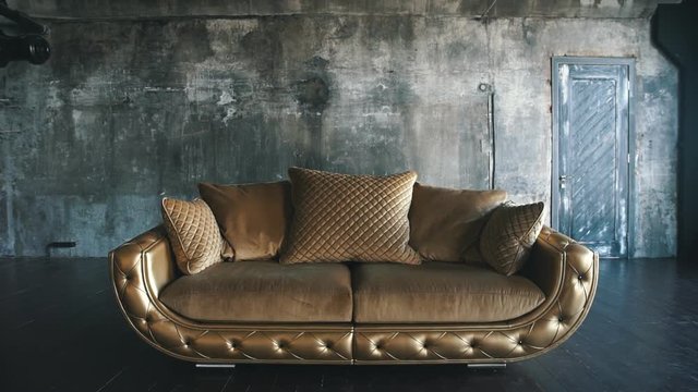 luxury quilted sofa in the Studio in gold color