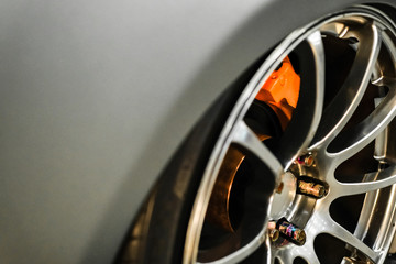 Close up of rims from a sports car. The concept of tuning the wheels of a car. Car wheel.