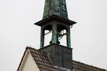 Catholic church bell tower against a overcast sky