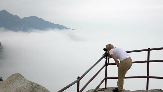 Caucasian Female Tourist Taking Photo of Ulsanbawi Rock. Mountain in Seoraksan National Park, South Korea