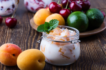 Healthy breakfast with apricot yogurt and fresh  summer fruits
