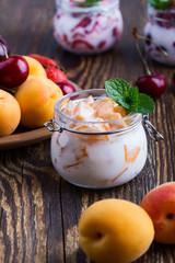 Healthy breakfast with apricot yogurt and fresh  summer fruits