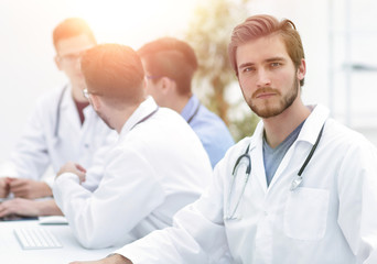 Fototapeta premium confident therapist, on the background of his colleagues
