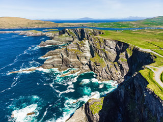 Amazing wave lashed Kerry Cliffs, widely accepted as the most spectacular cliffs in County Kerry, Ireland - obrazy, fototapety, plakaty
