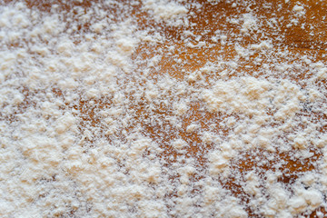 Top side view on white flour on rustic wooden table background, closeup of healthy cooking copyspace surface at home, restaurant, fabric plant