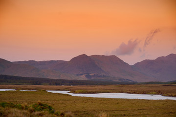 Beautiful sunset view of Connemara. Scenic Irish countryside landscape with magnificent mountains...