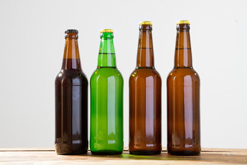 Beer bottles on a wooden table . Top view. Selective focus. Mock up. Copy space.Template. Blank.