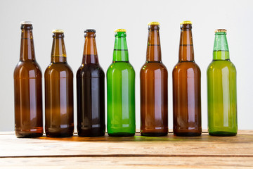 Beer bottles on a wooden table . Top view. Selective focus. Mock up. Copy space.Template. Blank.
