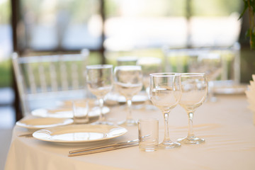 luxury airy summer restaurant in white with transparent chairs and ready to party