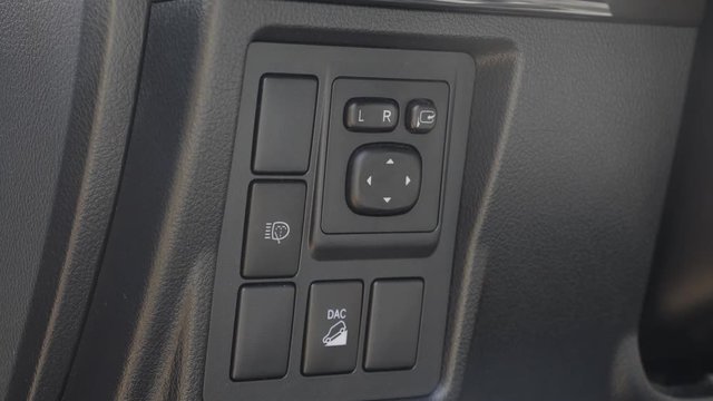 Somebody presses the buttons of downhill assist control button
