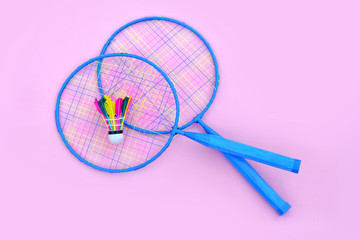Badminton, set for tennis, rackets, shuttlecock, isolated on a pink background, bright illustration