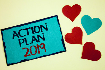 Word writing text Action Plan 2019. Business concept for Challenge Ideas Goals for New Year Motivation to Start Turquoise note ideas black red letters words hearts frame beige background.