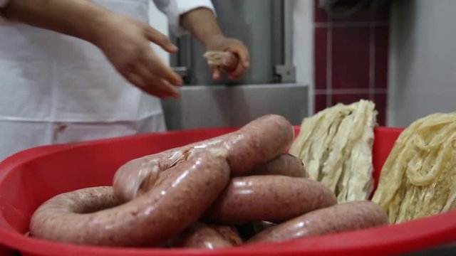 Butcher making sausages , sucuk
