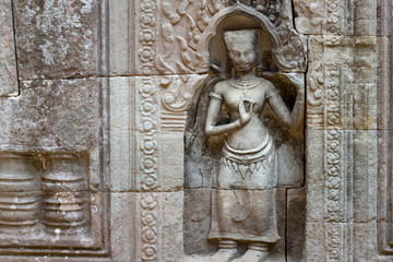Ancient stone woman figure of Banteay Kdei temple, Angkor Wat, Cambodia. Ancient temple bas-relief.