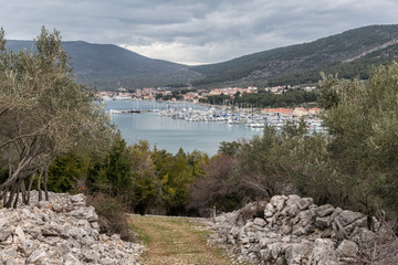Fototapeta premium City of Cres, marina and sea on a cloudy day in spring