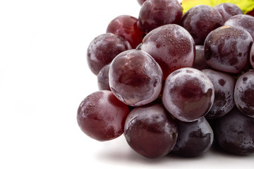 Close up of Red grapes on a white background