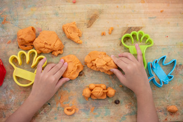 Children's hands Playing Colorful Clay
