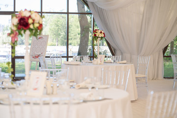 luxury airy summer restaurant in white with transparent chairs and ready to party