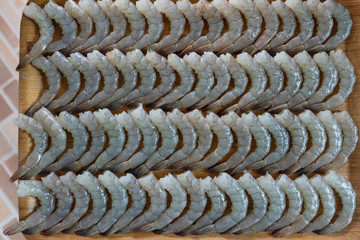 Peeled shrimp placed on a tray. Fresh seafood.