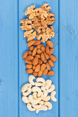 Various nuts as source minerals, vitamin B7 and fiber, nutritious eating concept
