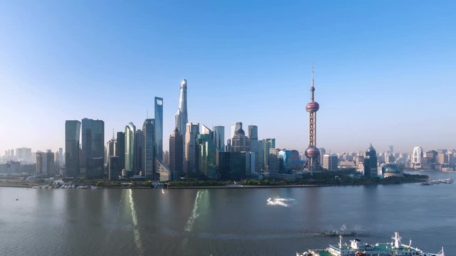 time lapse of shanghai skyline in morning,  huangpu river and modern metropolitan cityscape