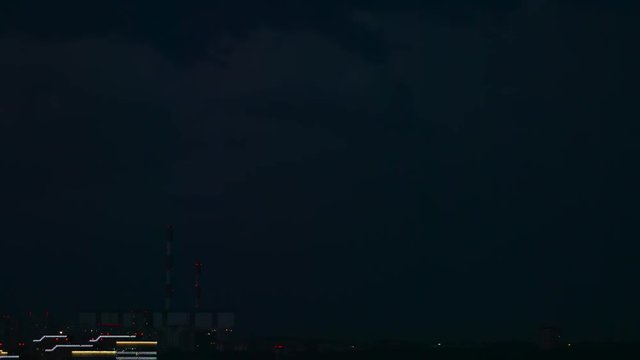 Flash of lightning over a power factory in the night